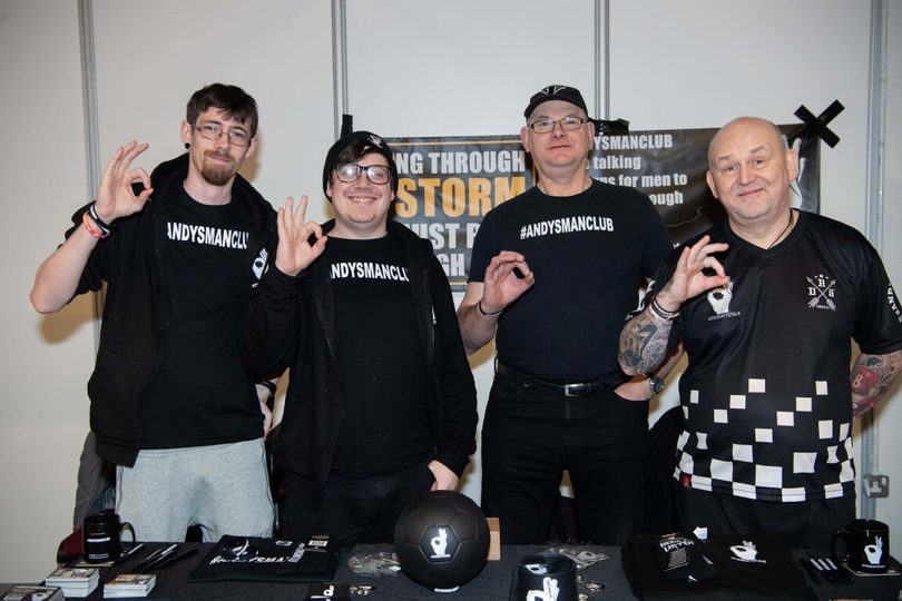 A group of men posing for a photo