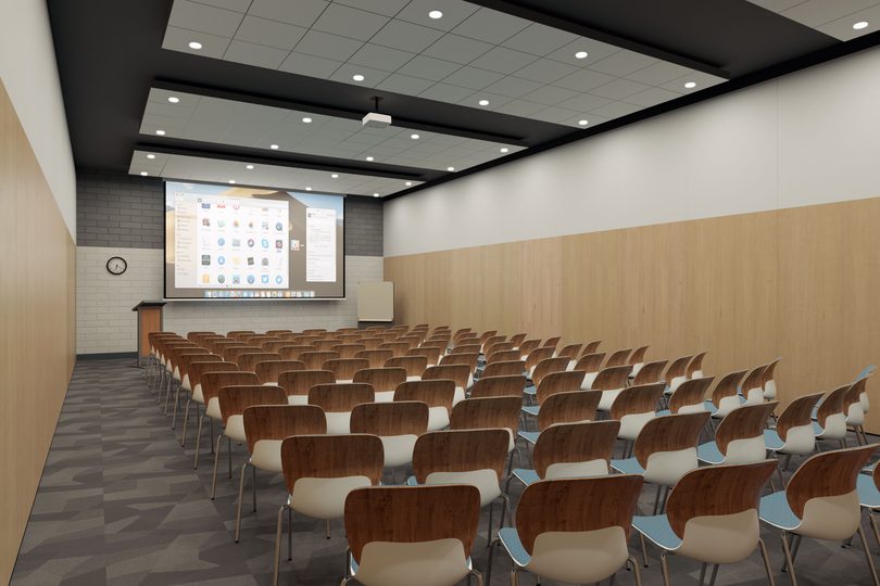 A spacious meeting room with project and chairs in theatre setting